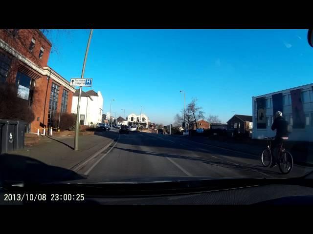 Bad cyclist drifts across lanes without warning.