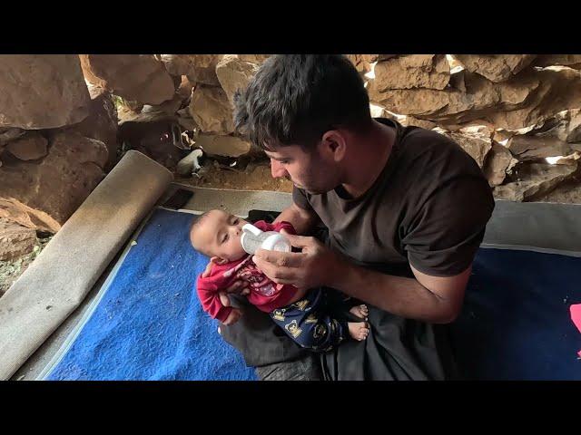 The nomadic man and his baby son returned to the hut and the man prepared powdered milk for his son