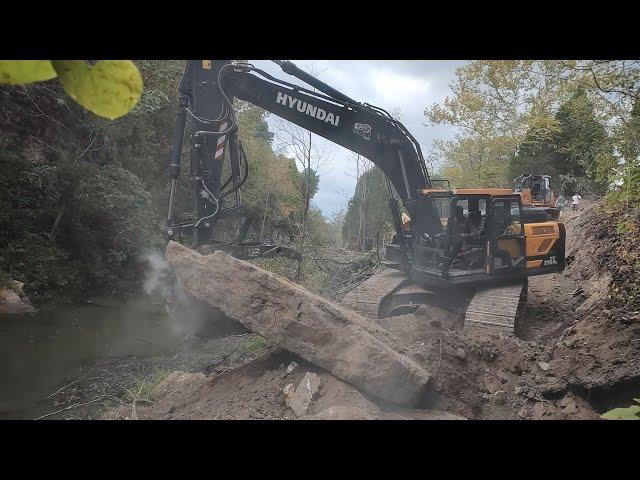 Building A Road Down The Mountain To Dam Up An Abandon Quarry