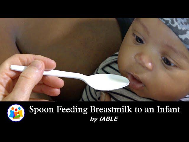 Spoon Feeding Breastmilk to a Newborn