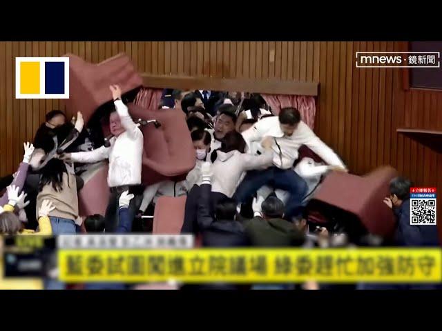 Taiwanese lawmakers brawl in parliament session