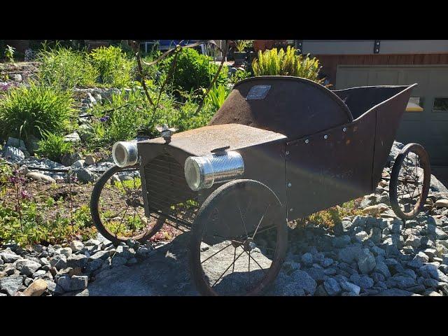 Wheelbarrow car yard art