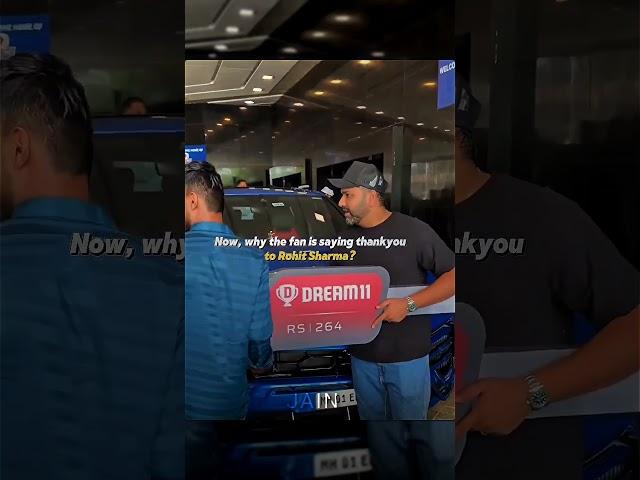 What is Rohit Sharma doing with his fan(s)?