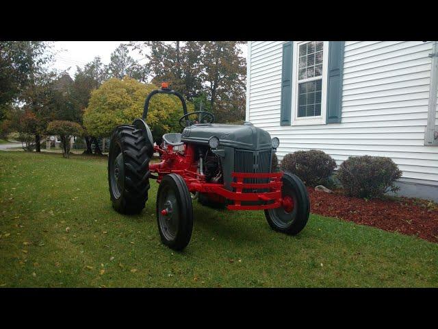 Installing the new front bumper on a 1952 Ford 8N farm tractor