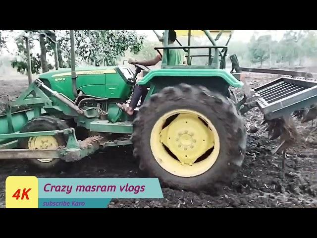 John Deere 5050D||with front  dozer and palau working on farmer