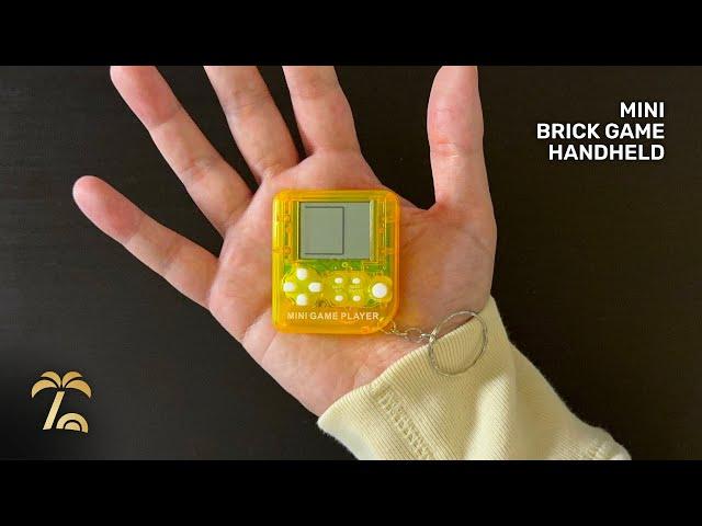 This cheap handheld is nearly the size of a palm  | Mini “Brick Game” Handheld Keychain