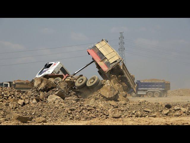 Incredible Dump Truck unloading accident overturned recovery by wheel loader and Excavator