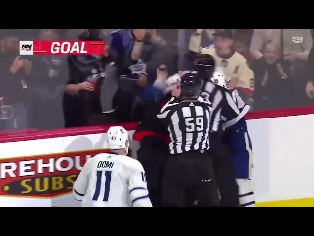 Morgan Rielly cross checks Ridly Greig in the face