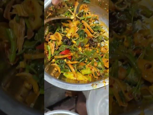 Buy a spicy vegetarian dish on the street and take a look at what dishes it contains?