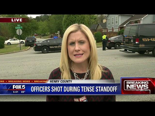 Henry County Police officers shot; hostage situation