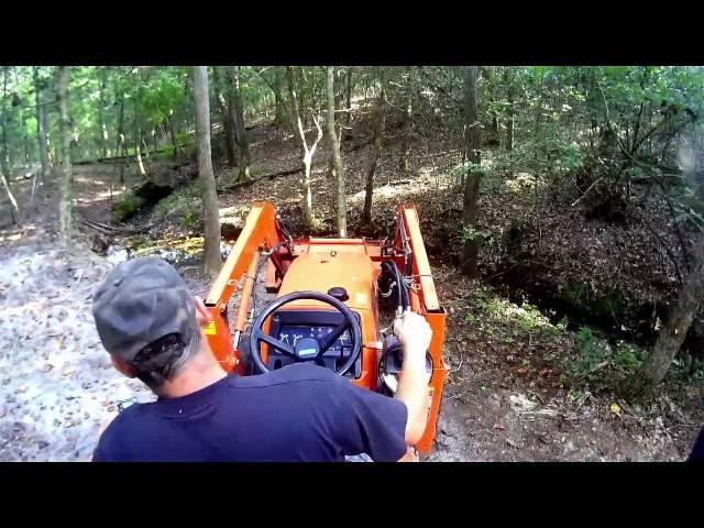 digging a small fish pond with the Kubota tractor