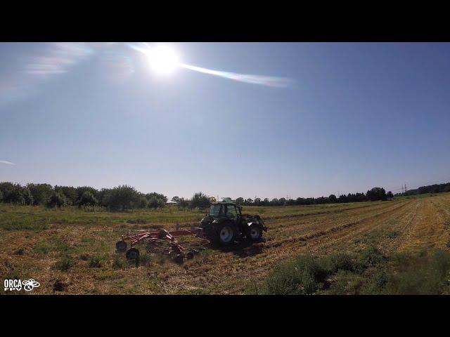 A field, a tractor, a copter