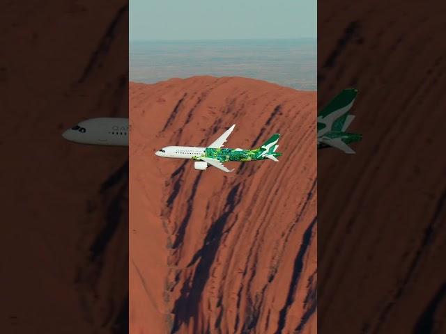 QantasLink Airbus A220 'Minyma Kutjara Tjukurpa' flies over Uluru