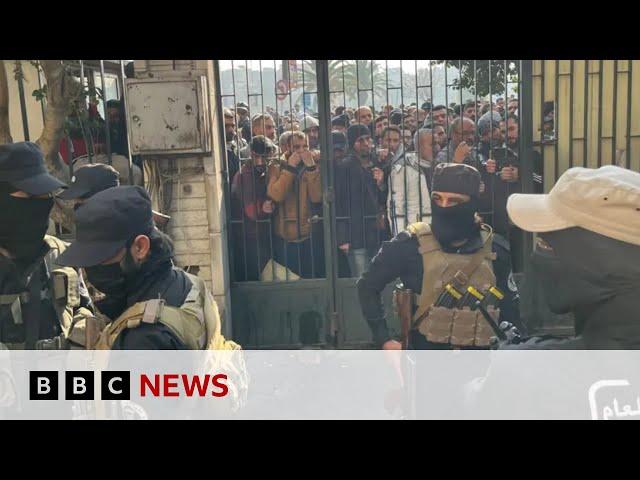 Assad's soldiers give up their weapons in Syrian 'reconciliation centres' | BBC News