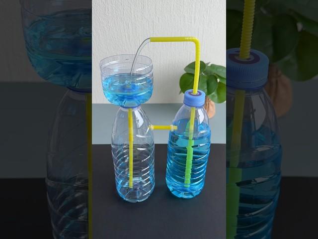 Water fountain made using two plastic bottles and straw#recycledcraft #handmadediy #parentchildcraft