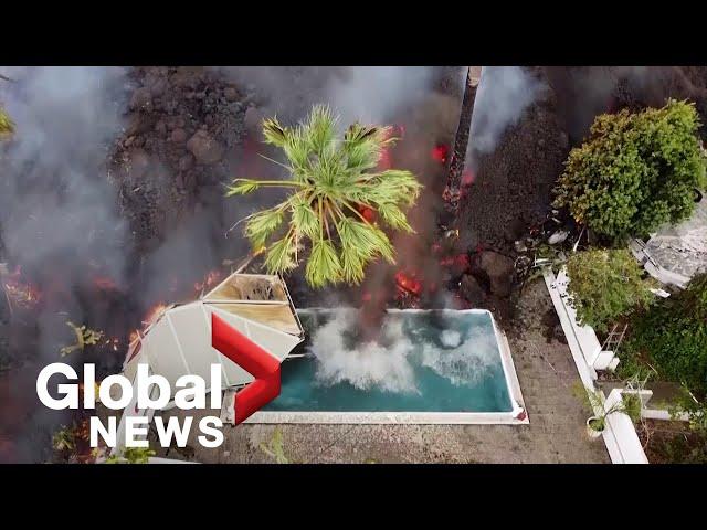 La Palma volcano: Drone video shows black lava swallowing pool, homes on its way to coast