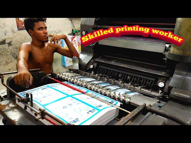 Heidelberg offset printing machine working. Skilled workers