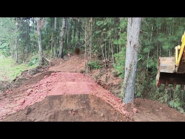 Excavator in the trench.. making a dam...