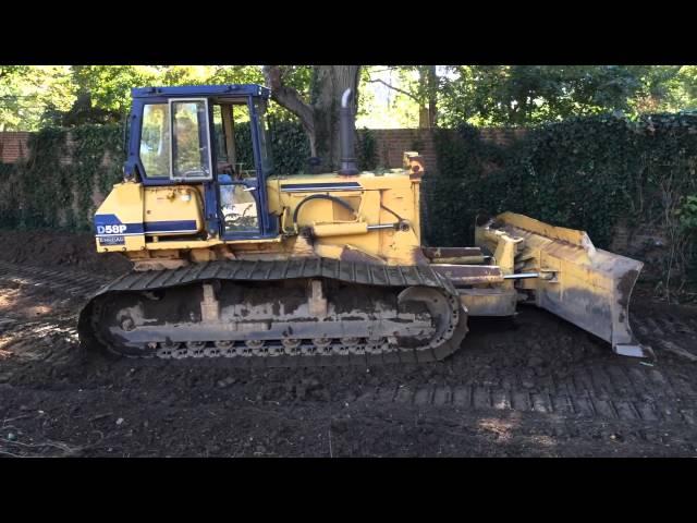 Komatsu D58P dozer grading.