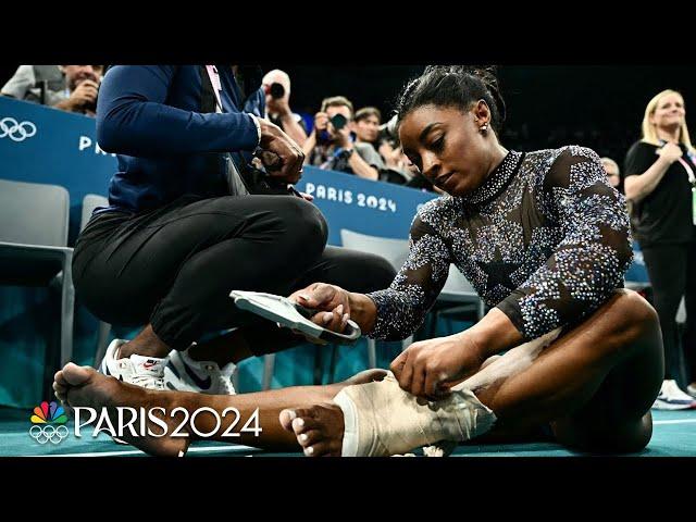 Simone Biles fights through calf pain to push U.S. into lead at Paris qualifications | NBC Sports