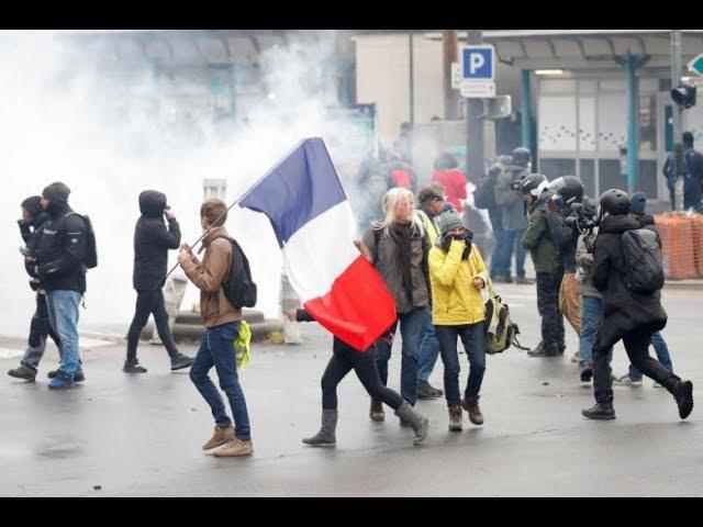 Paris police fire tear gas on 'yellow vest' protests anniversary