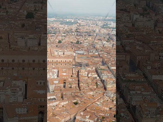 Vertical video. Bologna, Italy. Old Town. Two Towers. (Le due Torri) Garisenda and degli Asinelli...