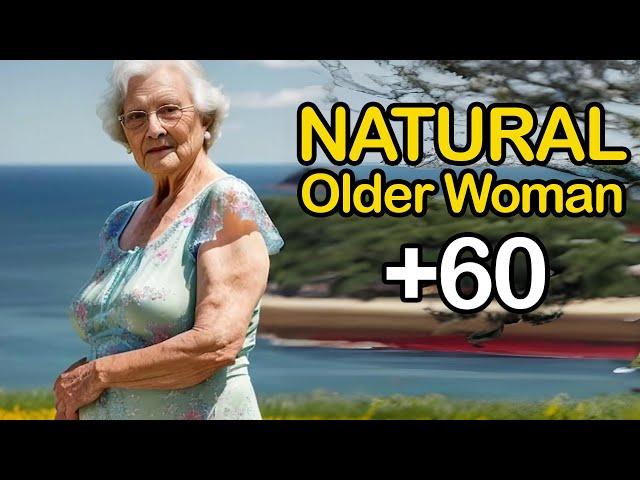 Natural Old Woman Over 60 Flowers and the Ocean Attractive And Classy Dressed