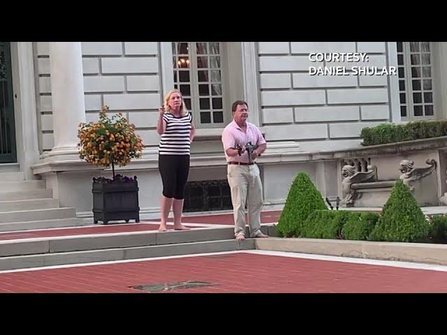 St. Louis couple aims firearms at protesters outside their home