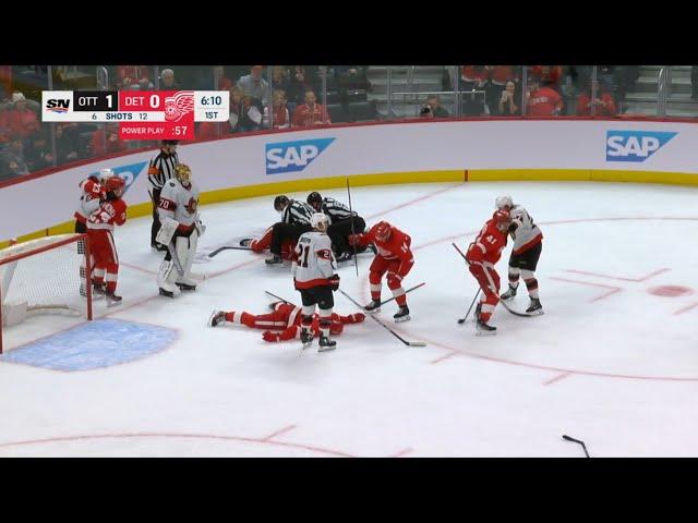 Larkin lies motionless on the ice, Perron gets ejected