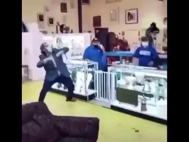 Employee plays better off alone on his tuba in the middle of a store