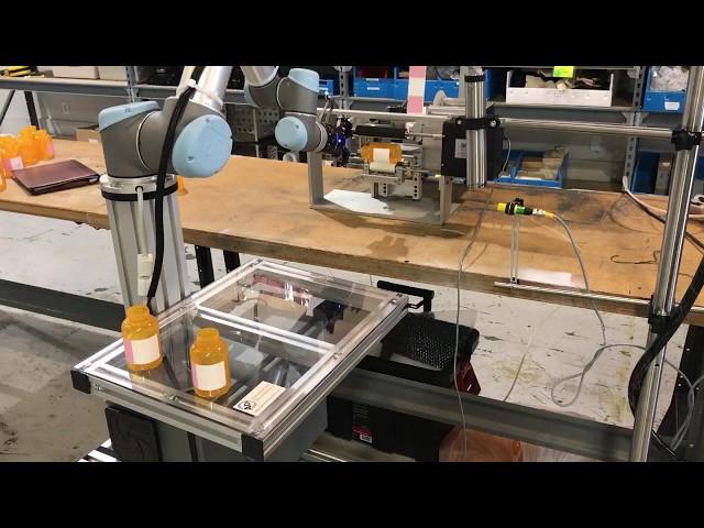 Universal Robots UR5 and Elmark Bottle Labeling Solution