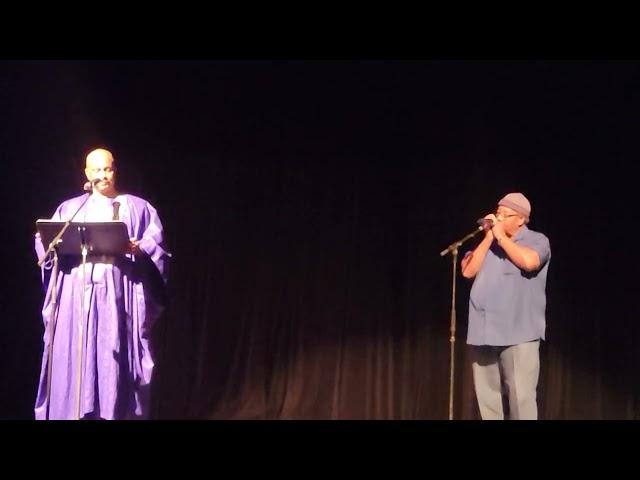 Henry L. Jones Poet Laureate reading poetry accompanied with musician Henry Perry on harmonica