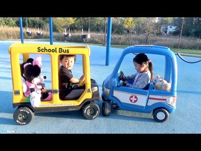 Riding School Bus and Ambulance Ride On Cars at the Playground