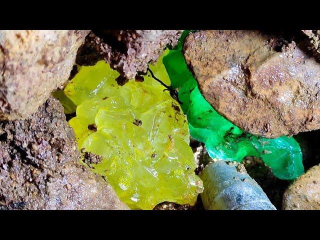 At the highest point of the cliff. A two-color diamond is hidden in the cracks of the rock.