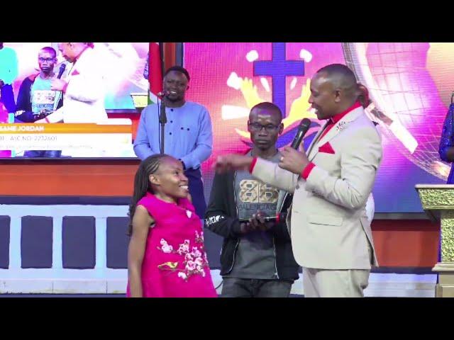 Bishop ben Kiengei heart warming moments with  disabled Girl at Jcm church