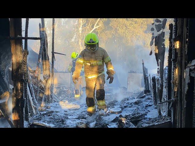 Firefighters at site in Israel's Safed after rockets fired from Lebanon | AFP