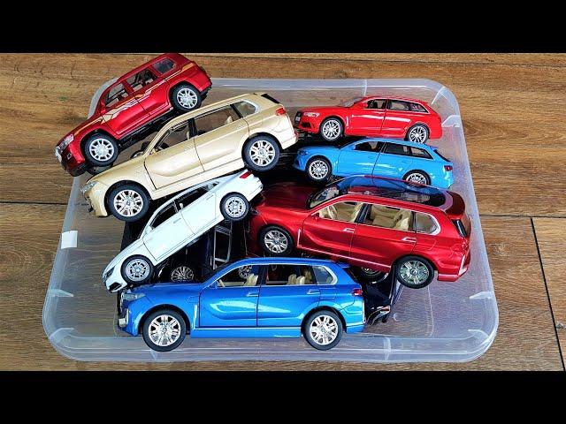 Box of diecast car models: Bmw x7, Audi RS8, VW Passat show