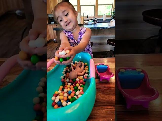 ASMR! Cute Baby Girl & Baby Doll Play with Gumballs in the Bath #satisfying #asmr #shorts #baby