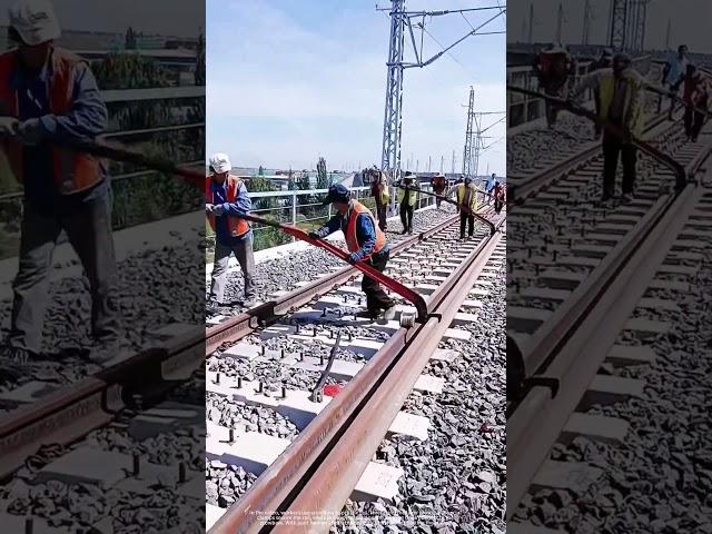 The Power of Levers and Pulleys: See How Workers Slide Railway Tracks.