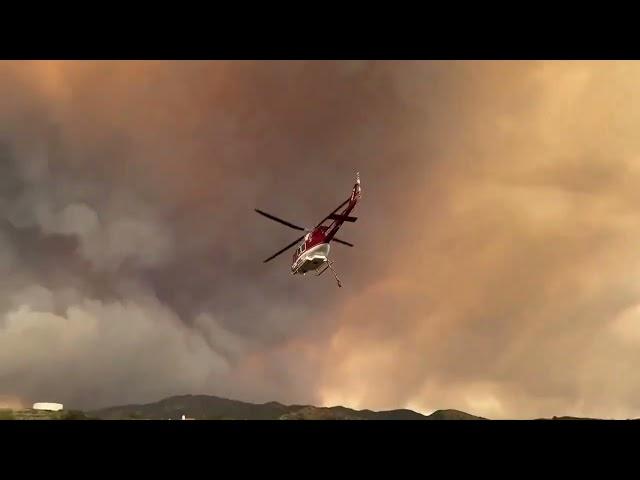 Firefighters work to control the Airport Fire in Orange County, California