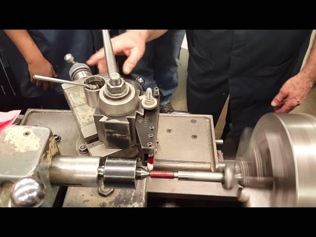 Instructor Kim Munson demonstrates thread cutting on a lathe Part3