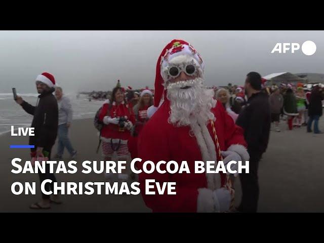 LIVE: Surfing Santas ride waves at Cocoa Beach on Christmas Eve I AFP