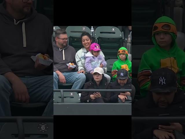 Kid in turtle costume gets foul ball and THROWS IT BACK!! 