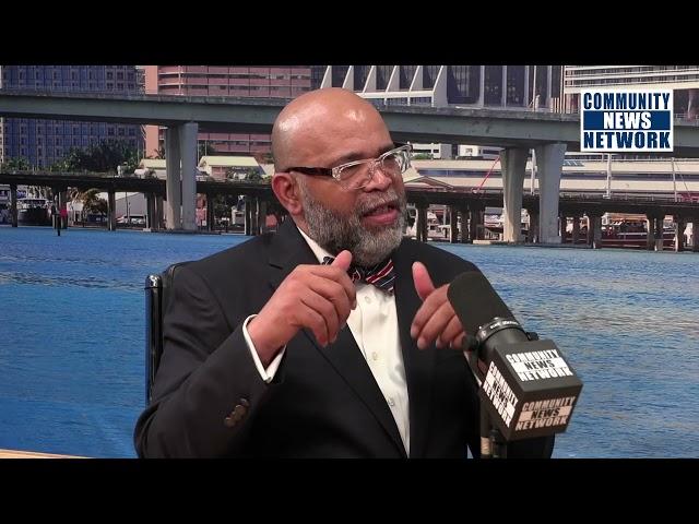 Executive Director  Rick Beasley speaks with Michael Miller during Black Business Month