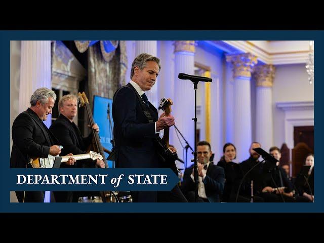 Secretary of State Blinken plays guitar at the launch of the Global Music Diplomacy Initiative