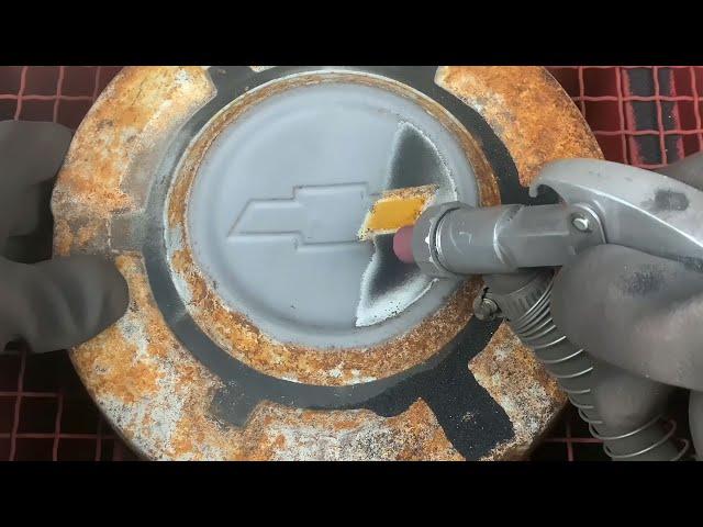 Sandblasting a Rusty Hubcap