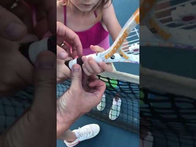 Teaching child backhand tennis grip using the Tennis Grip Guide found at tennisbuilder.com