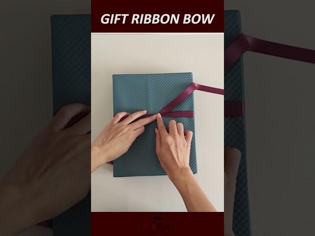 How to tie a ribbon bow on gift box