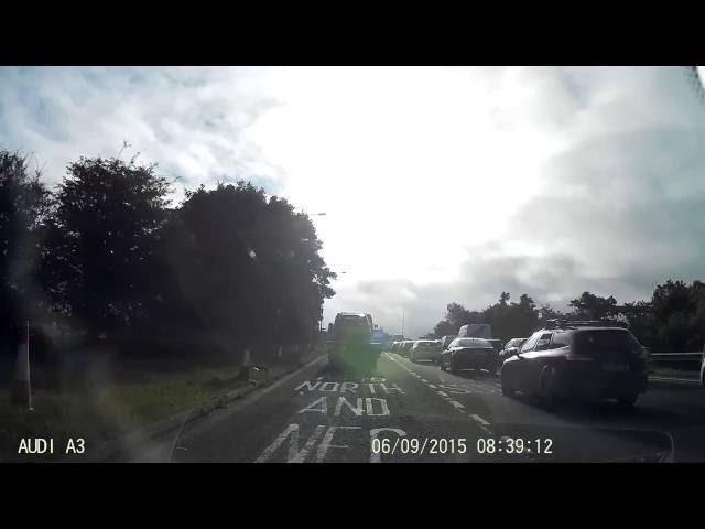 Cars illegally using hard shoulder to avoid queue