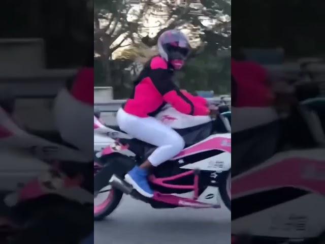 Pinky Bling rides  out on her Kawasaki 650 motorcycle.